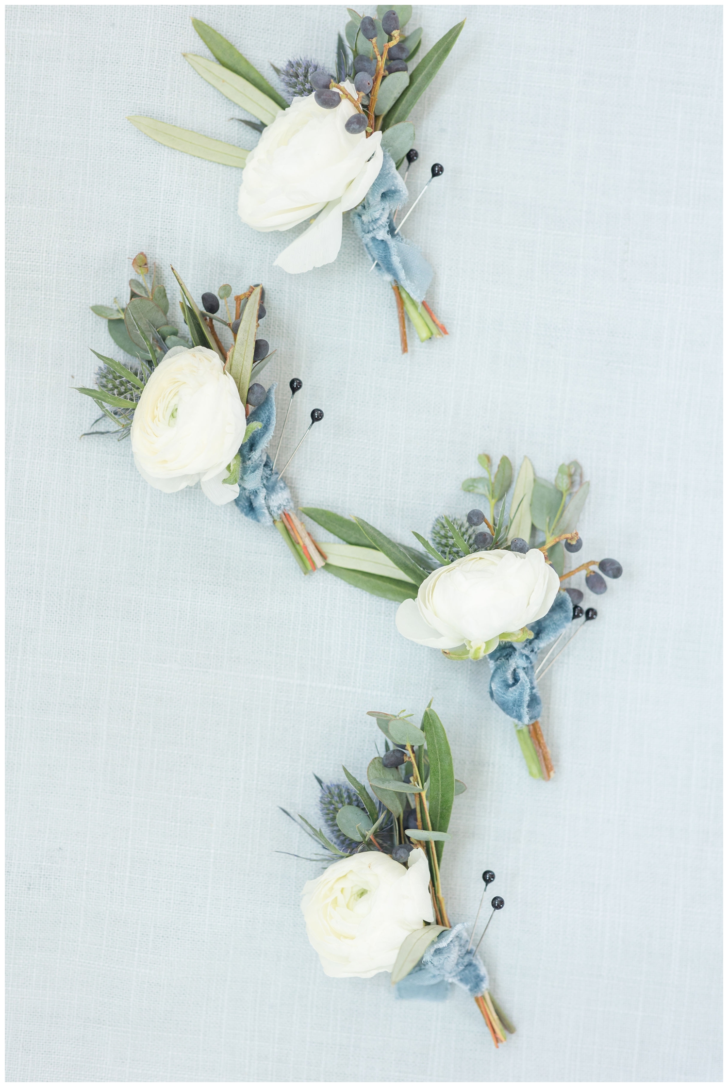 all white boutonnieres