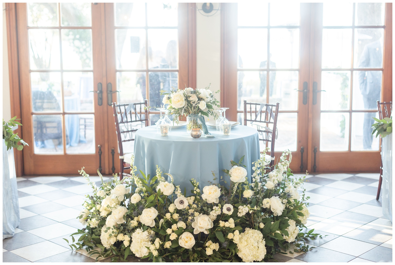 pale blue sweetheart table with all white florals