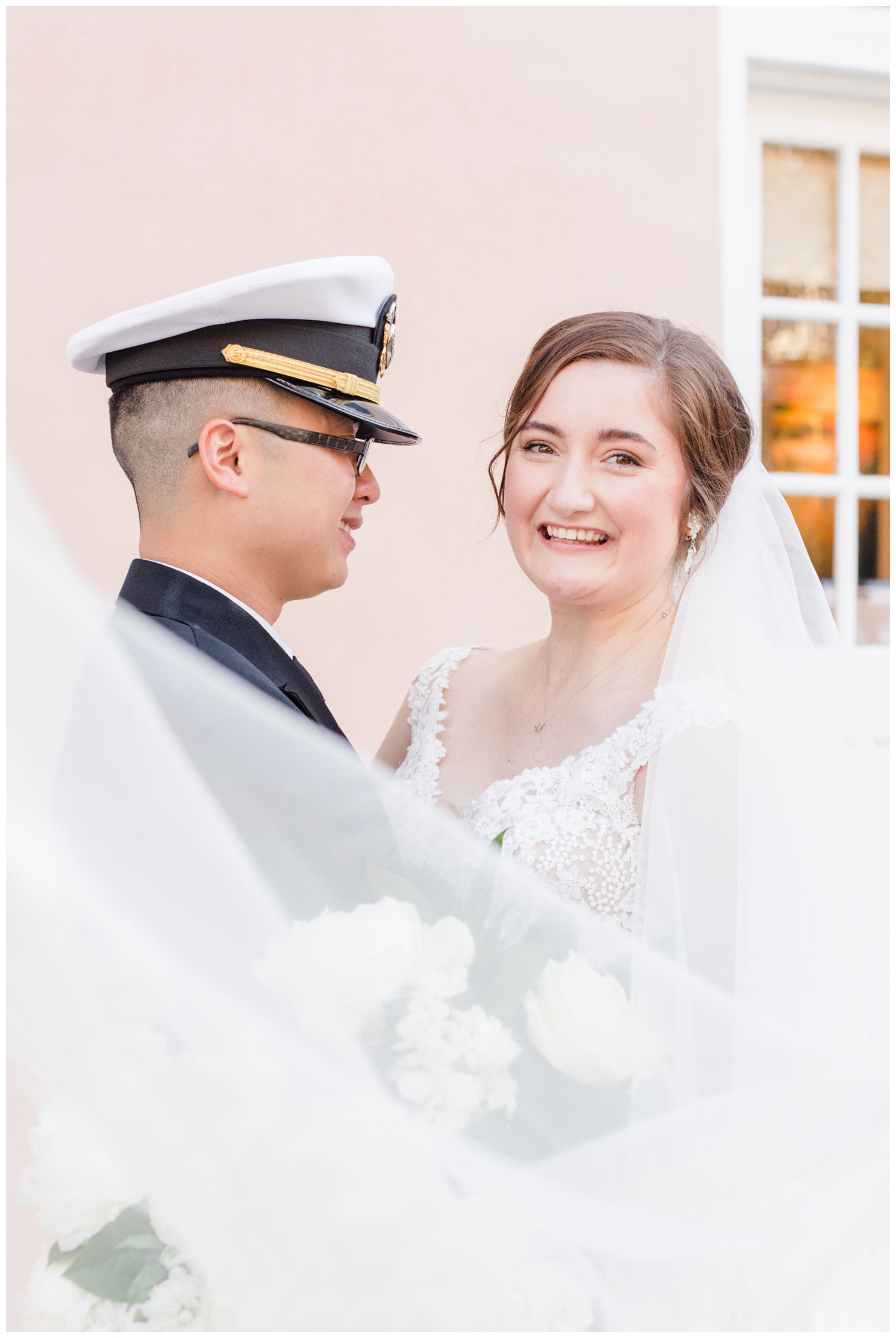 bride and groom portrait with veil swoop