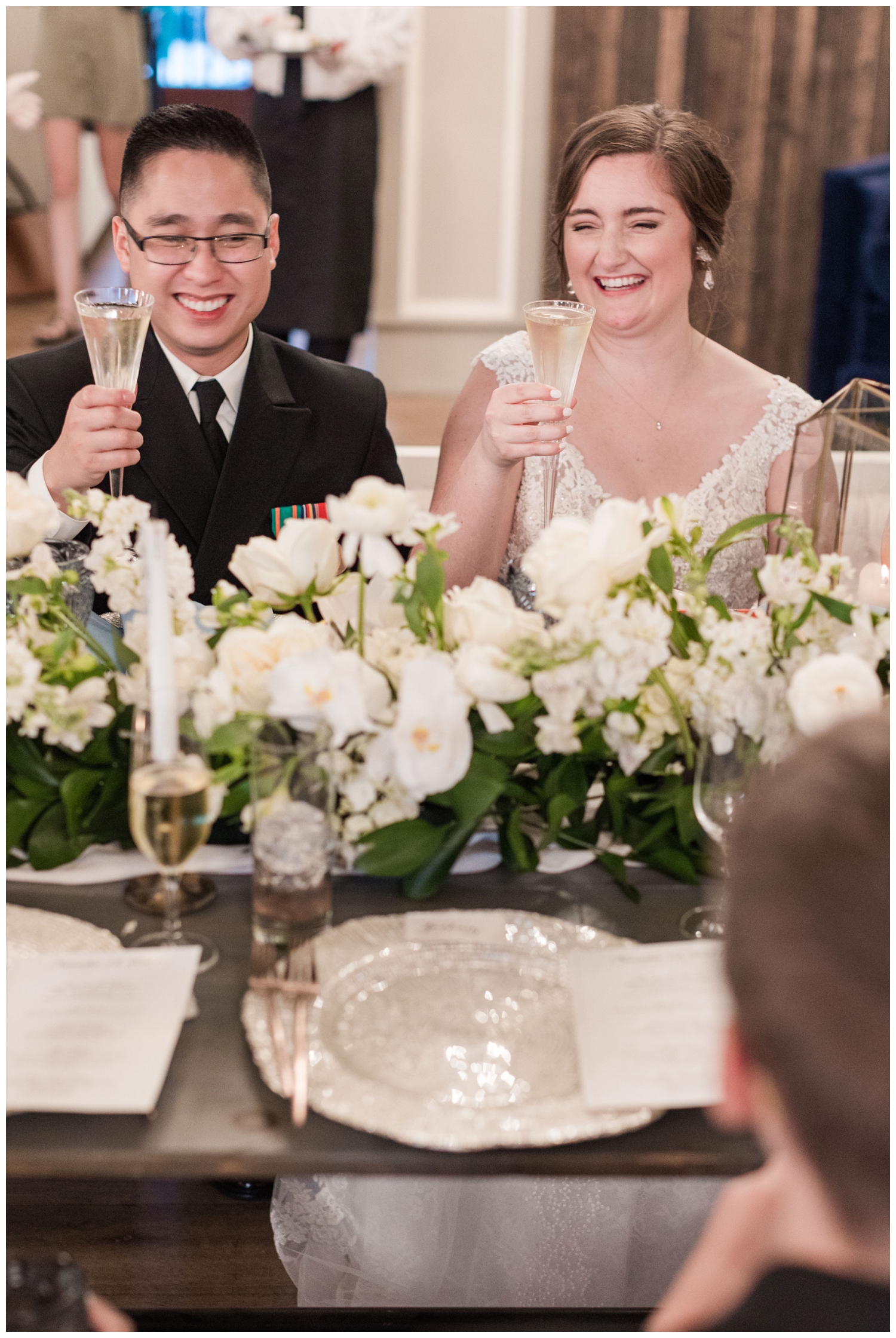 bride and groom toasting at reception in Merchants Hall