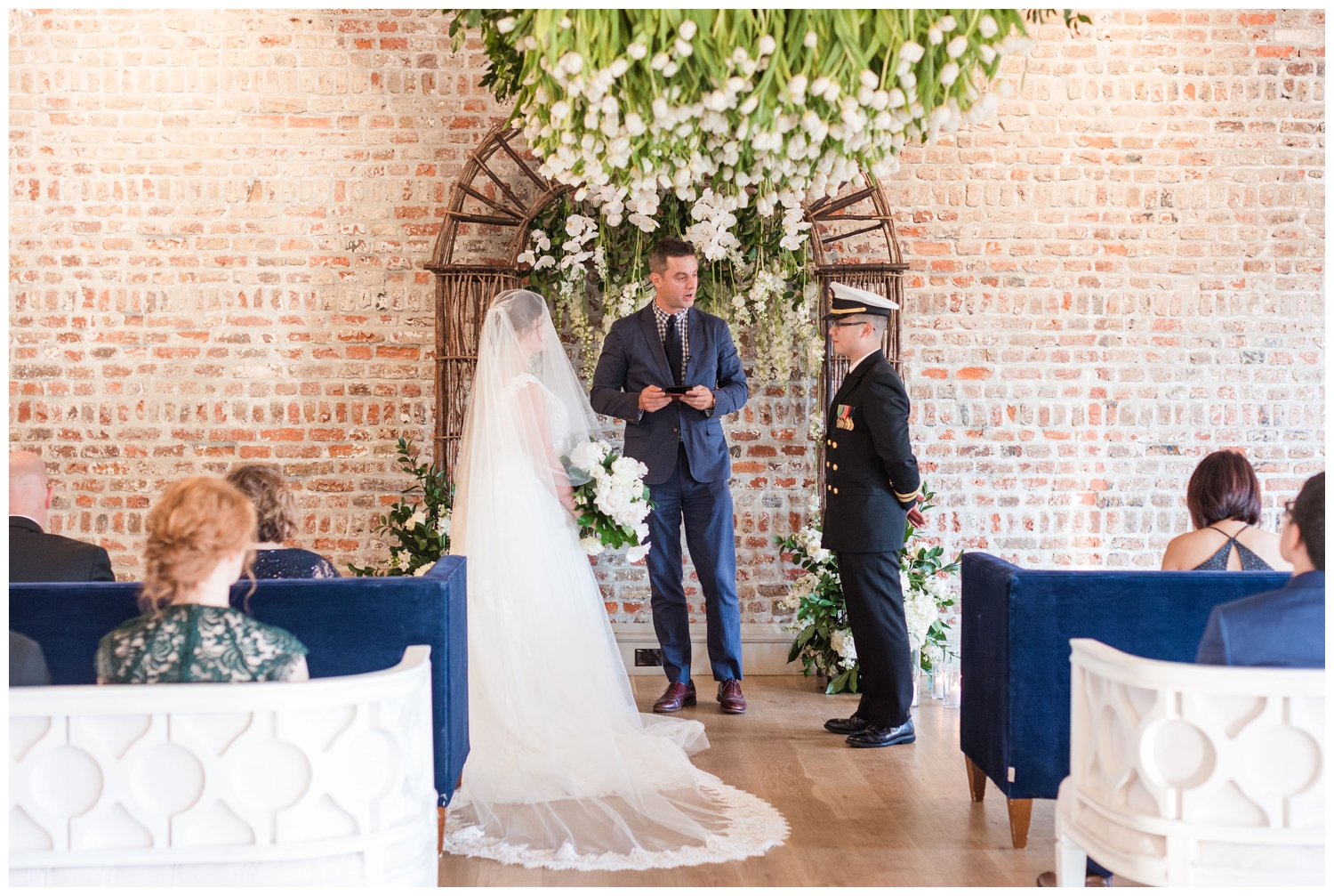 bride and groom at ceremony inside Merchants Hall in Charleston South Carolina