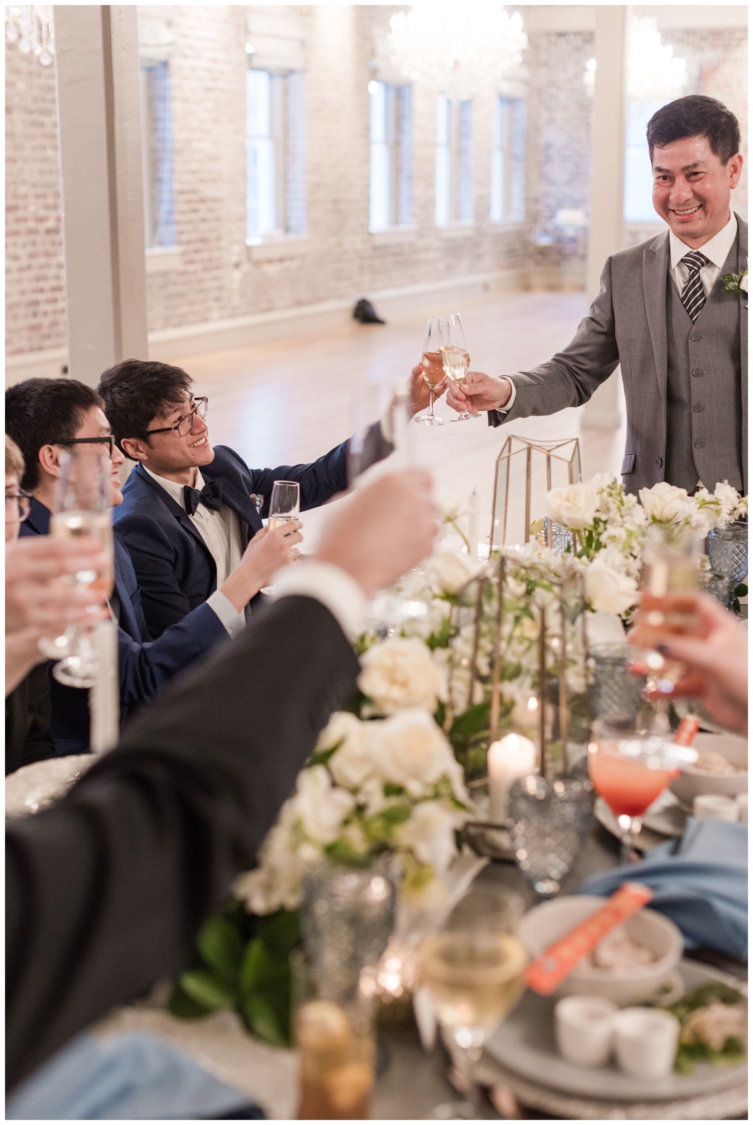 toasting at reception inside Merchants Hall in Charleston South Carolina