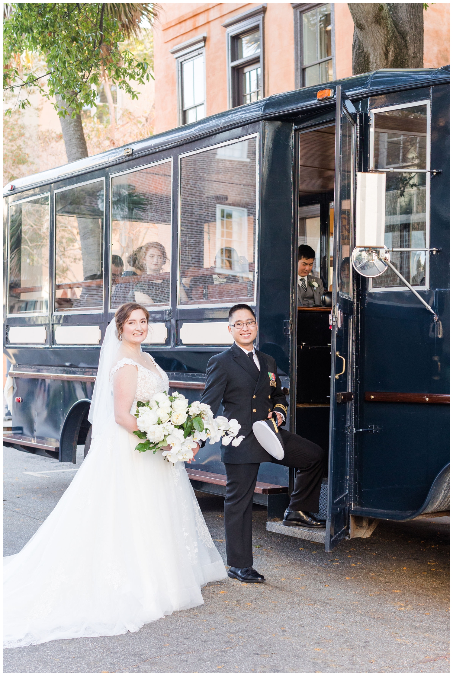 bride and groom portraits by the trolley in Charleston