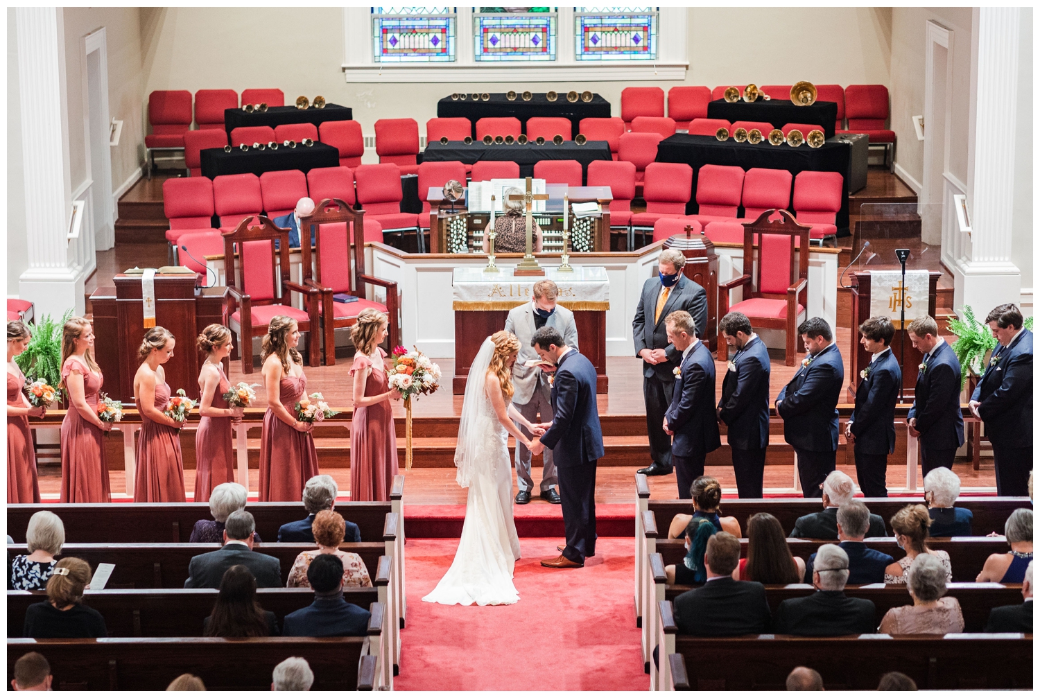 ceremony shot of a colorful fall Charleston wedding inside John Wesley United Methodist Church