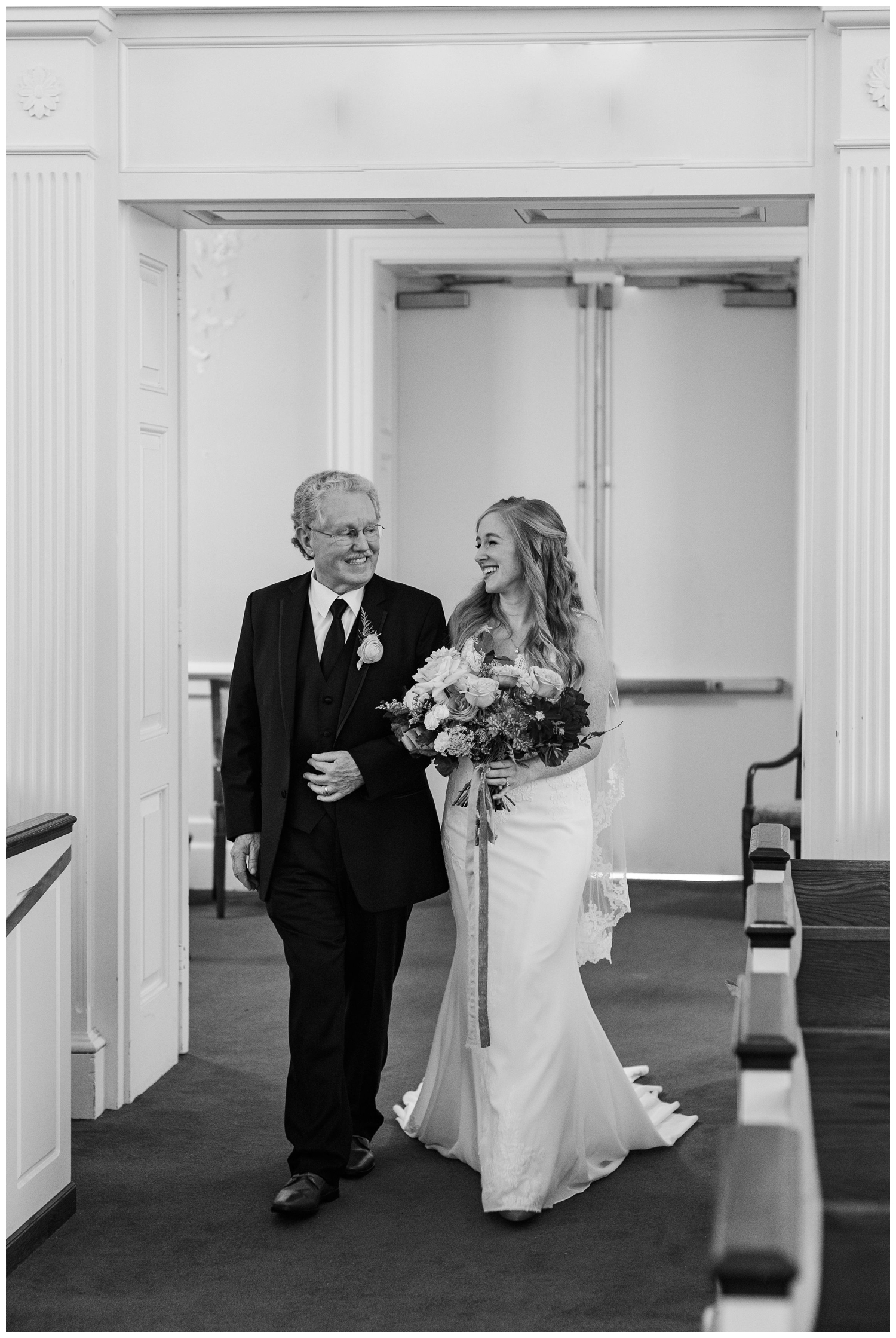 father and bride walking down the aisle on the ceremony of a colorful fall Charleston wedding