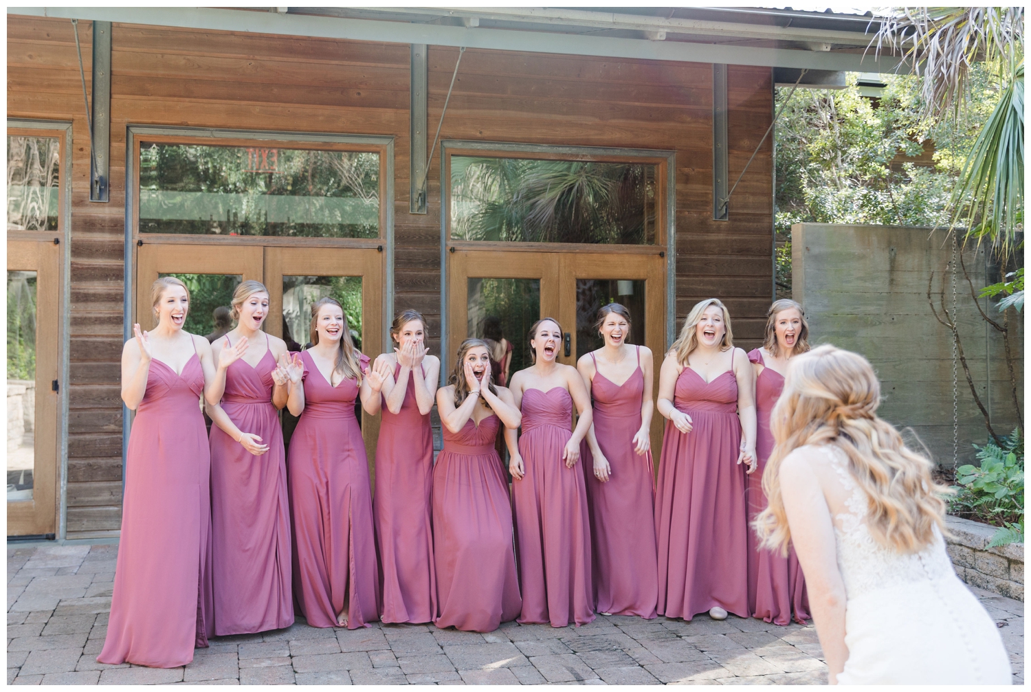colorful fall Charleston wedding with first look with bridesmaids in blush dresses