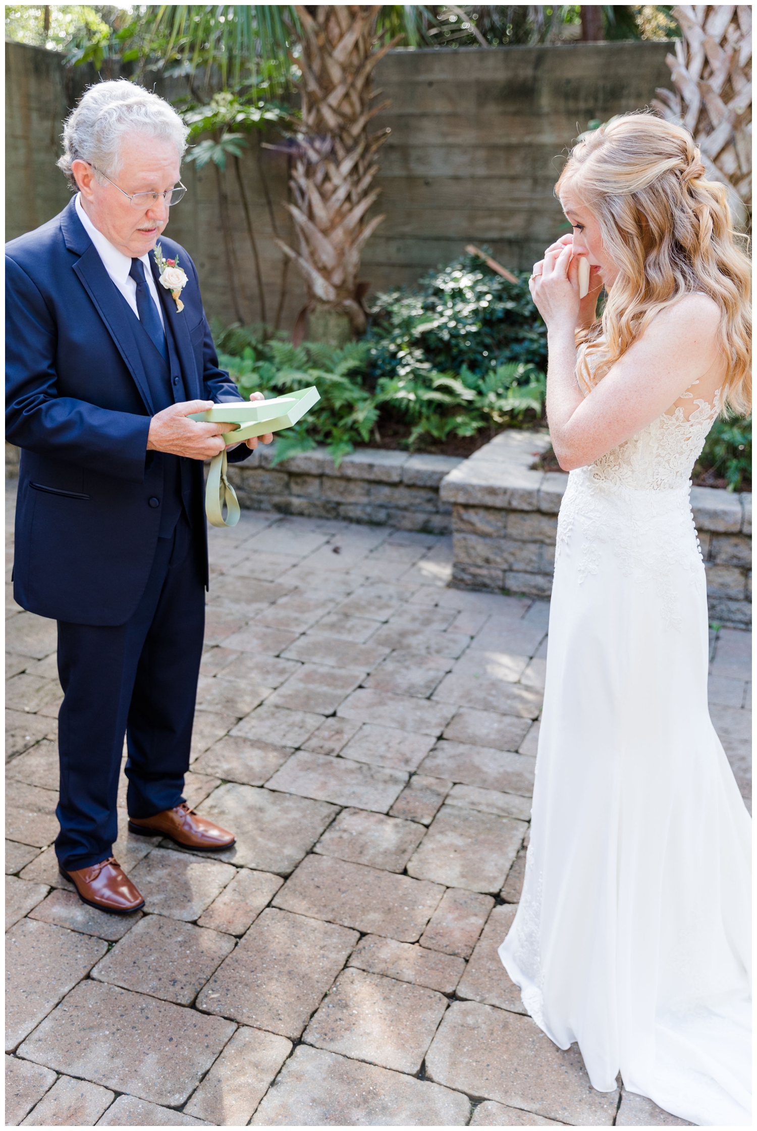 tearful first look with Dad outside Founders Hall for colorful fall Charleston wedding