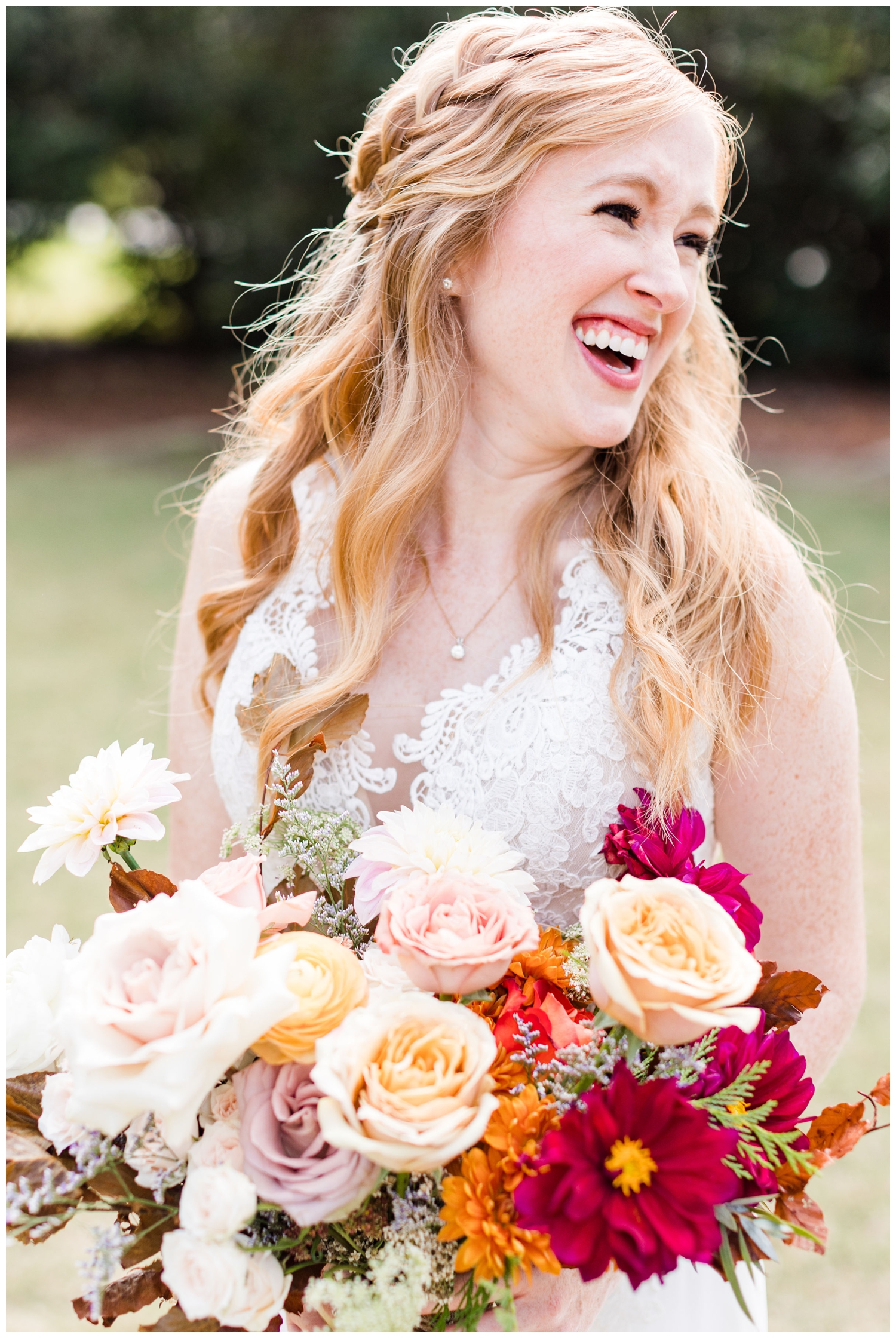 bride smiling and holding bright bouquet for a colorful fall Charleston wedding