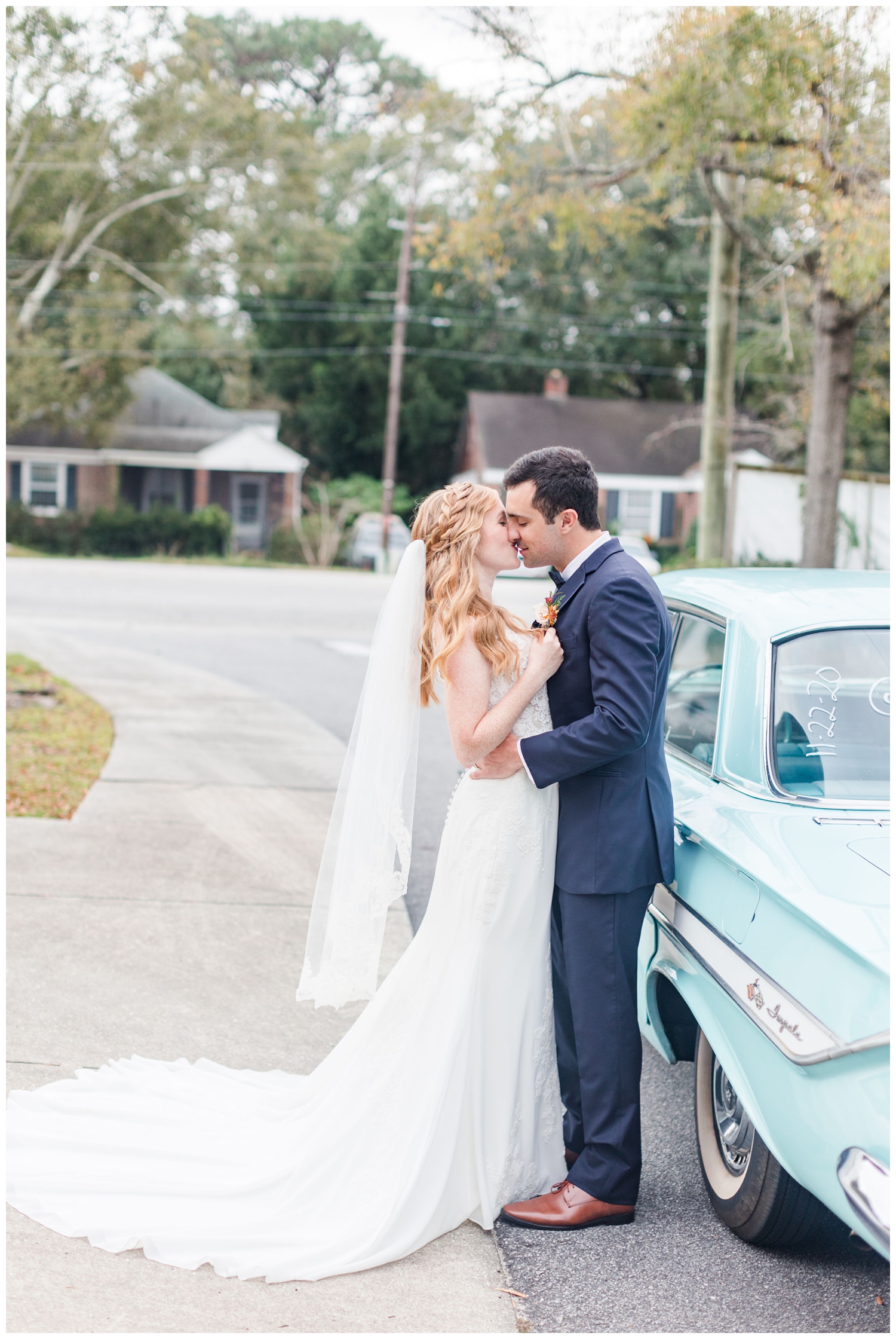 bride and groom kissing at get away car for colorful fall Charleston wedding