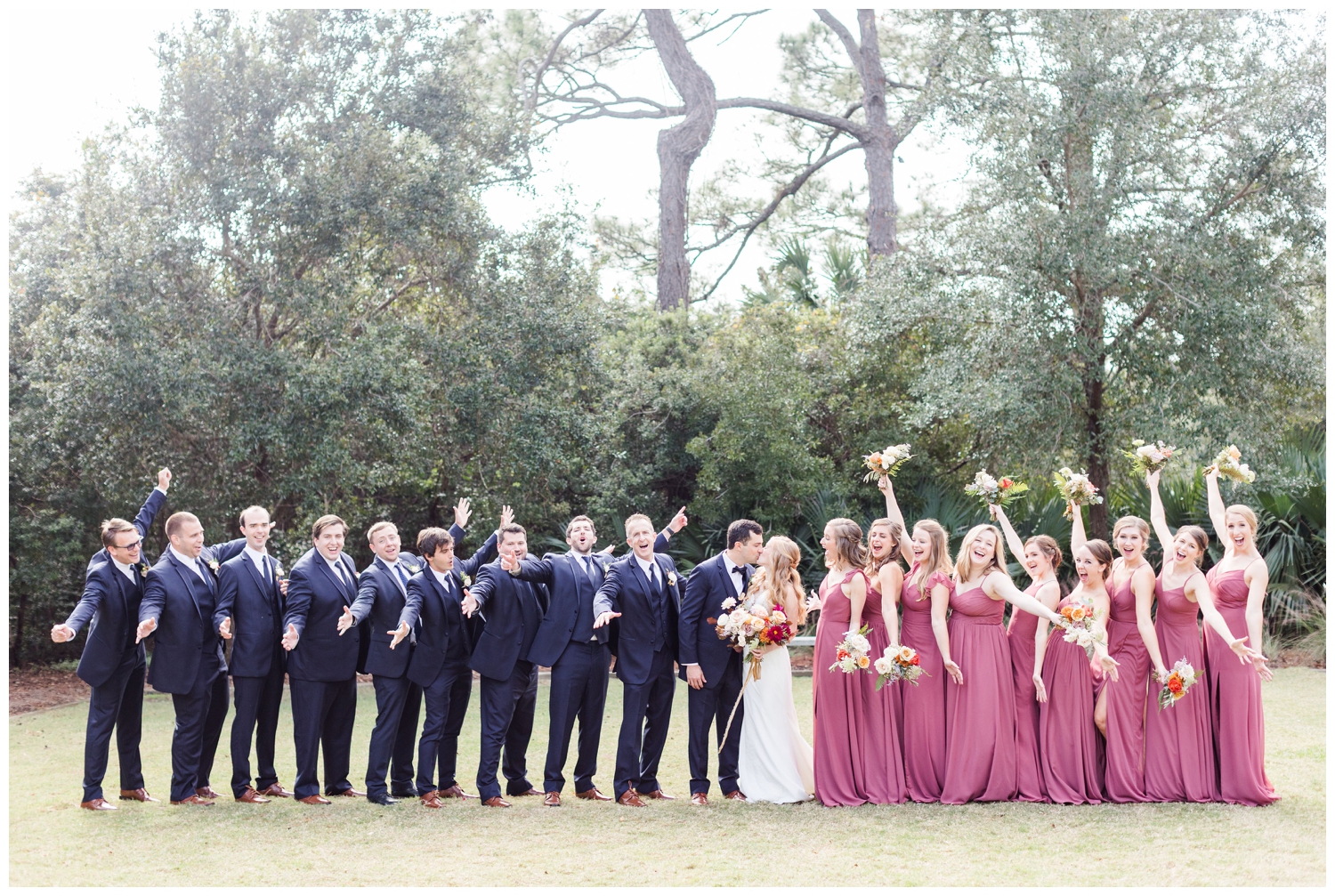 bridal party celebrating on the lawn at Founders Hall for a colorful fall Charleston wedding