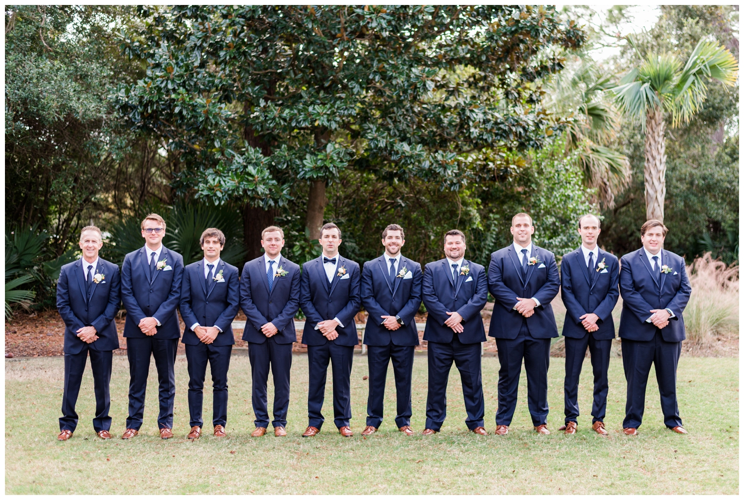 groom with groomsmen portraits for colorful fall Charleston wedding
