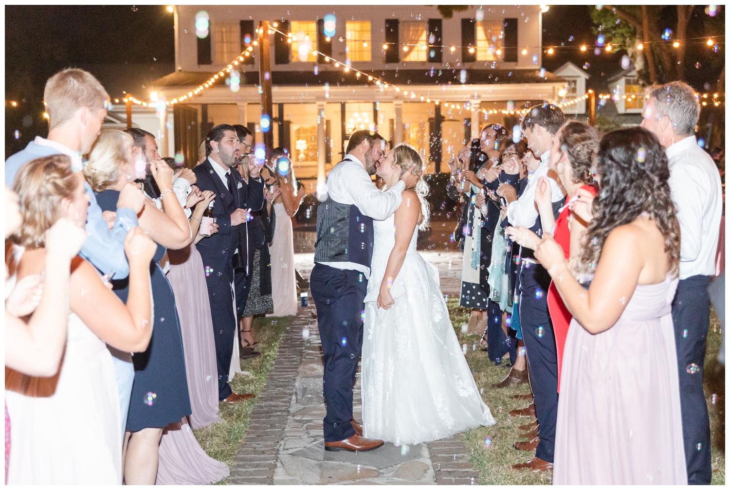 bride groom kissing bubble exit at Legare Waring House