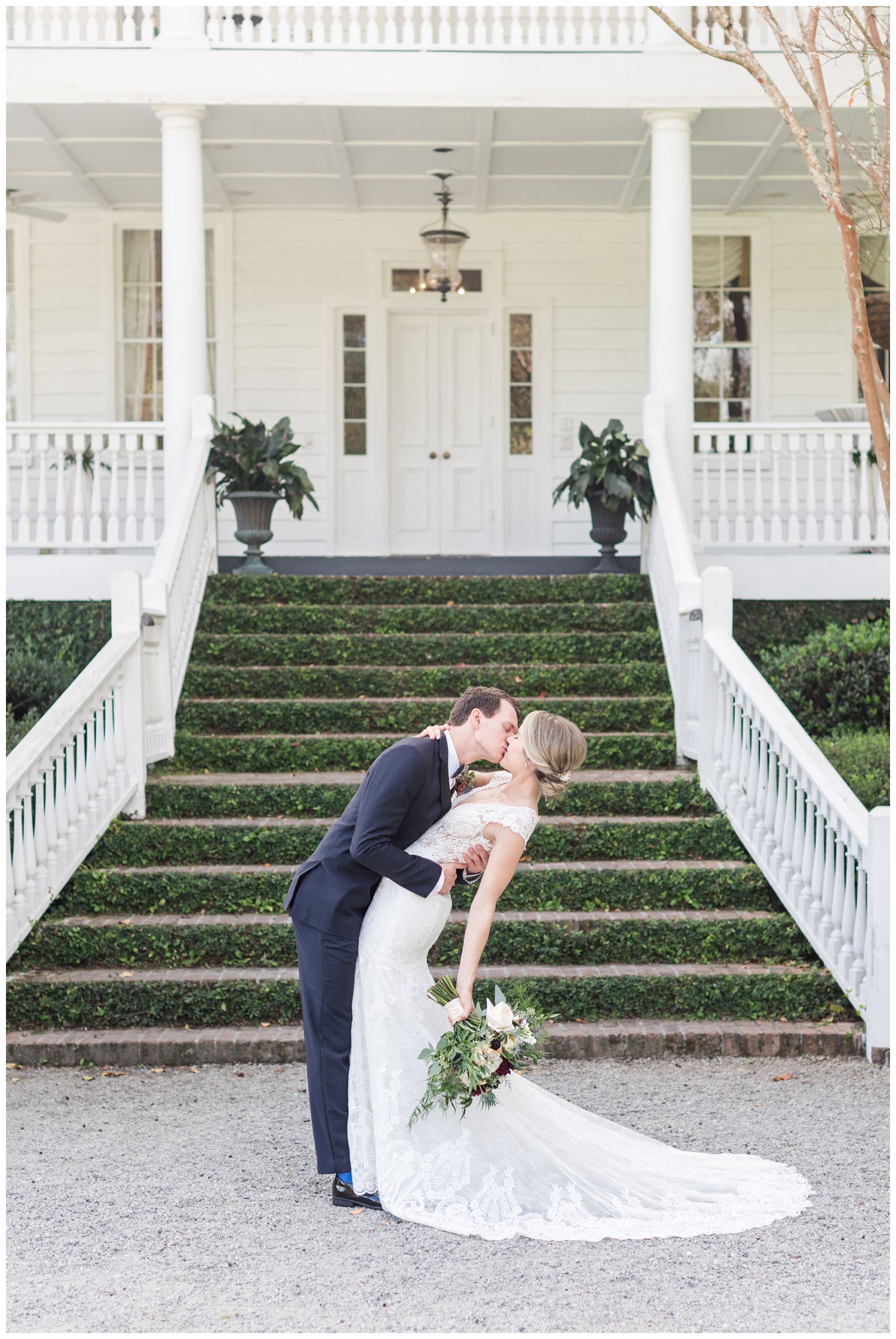 bride and groom kissing on stairs at Old Wide Awake in Charleston, South Carolina