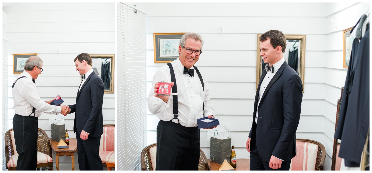 groom exchanging gifts with his father on wedding day