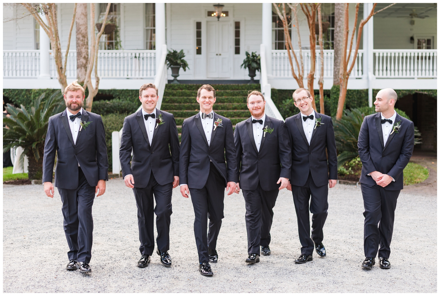 groomsmen outside front porch at Old Wide Awake