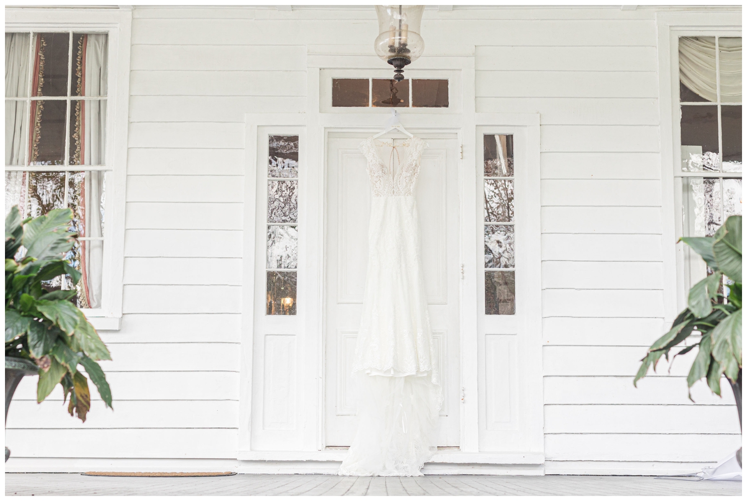 wedding dress hanging on porch at Old Wide Away