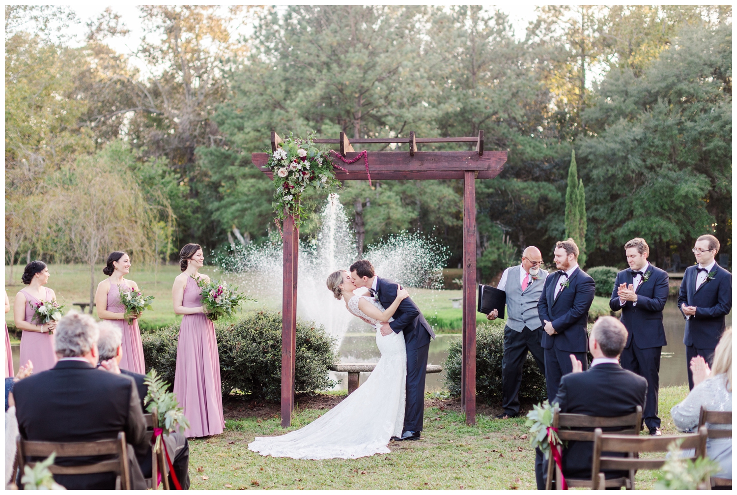 first kiss at outdoor timeless wedding ceremony at Old Wide Awake in Charleston, South Carolina