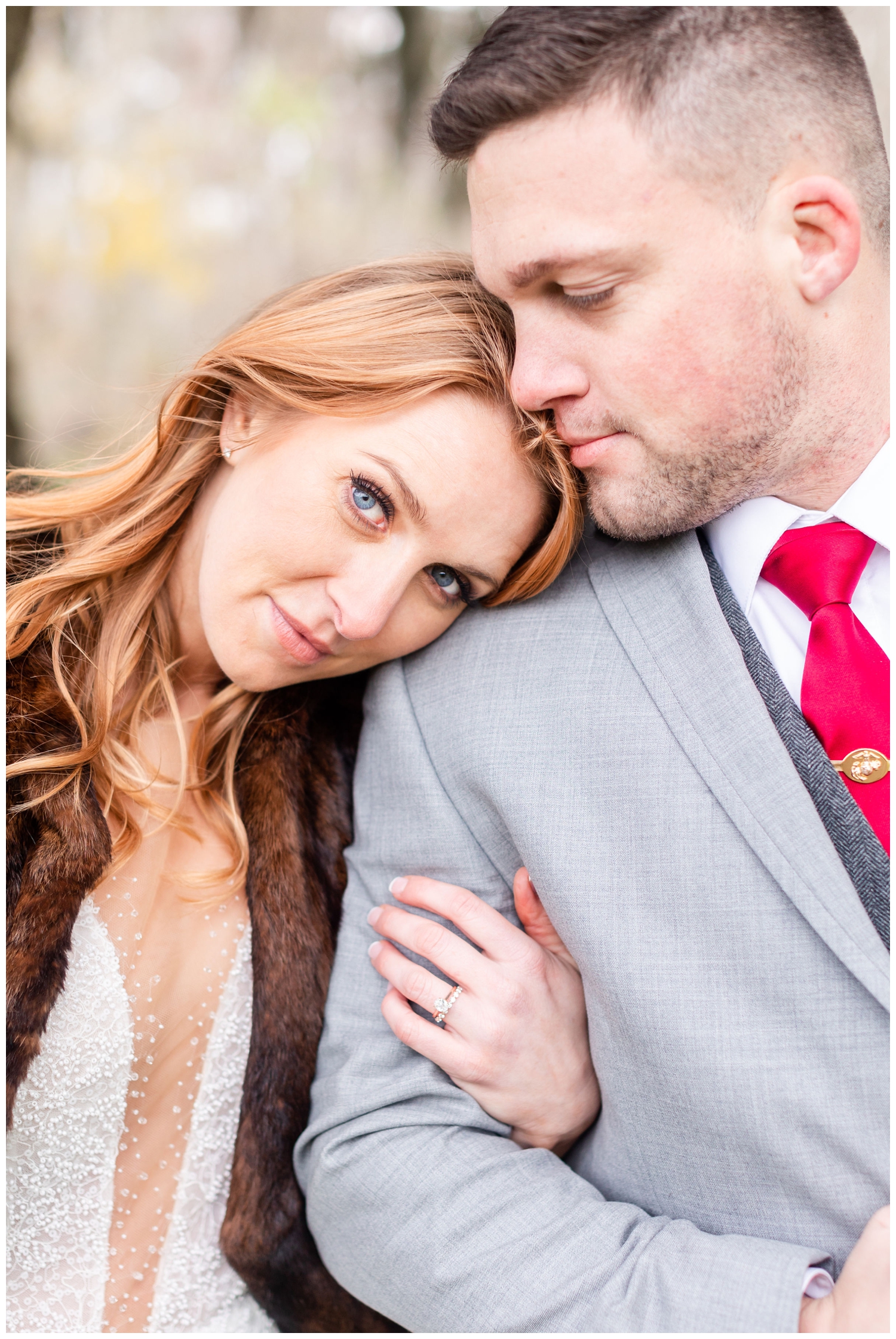 bride with head on groom's shoulder for intimate Charleston winter elopement