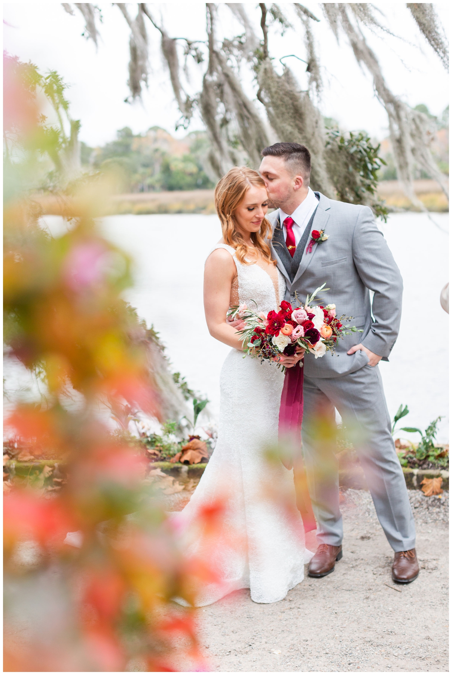 groom kissing bride at Magnolia Plantation and Gardens intimate Charleston winter elopement