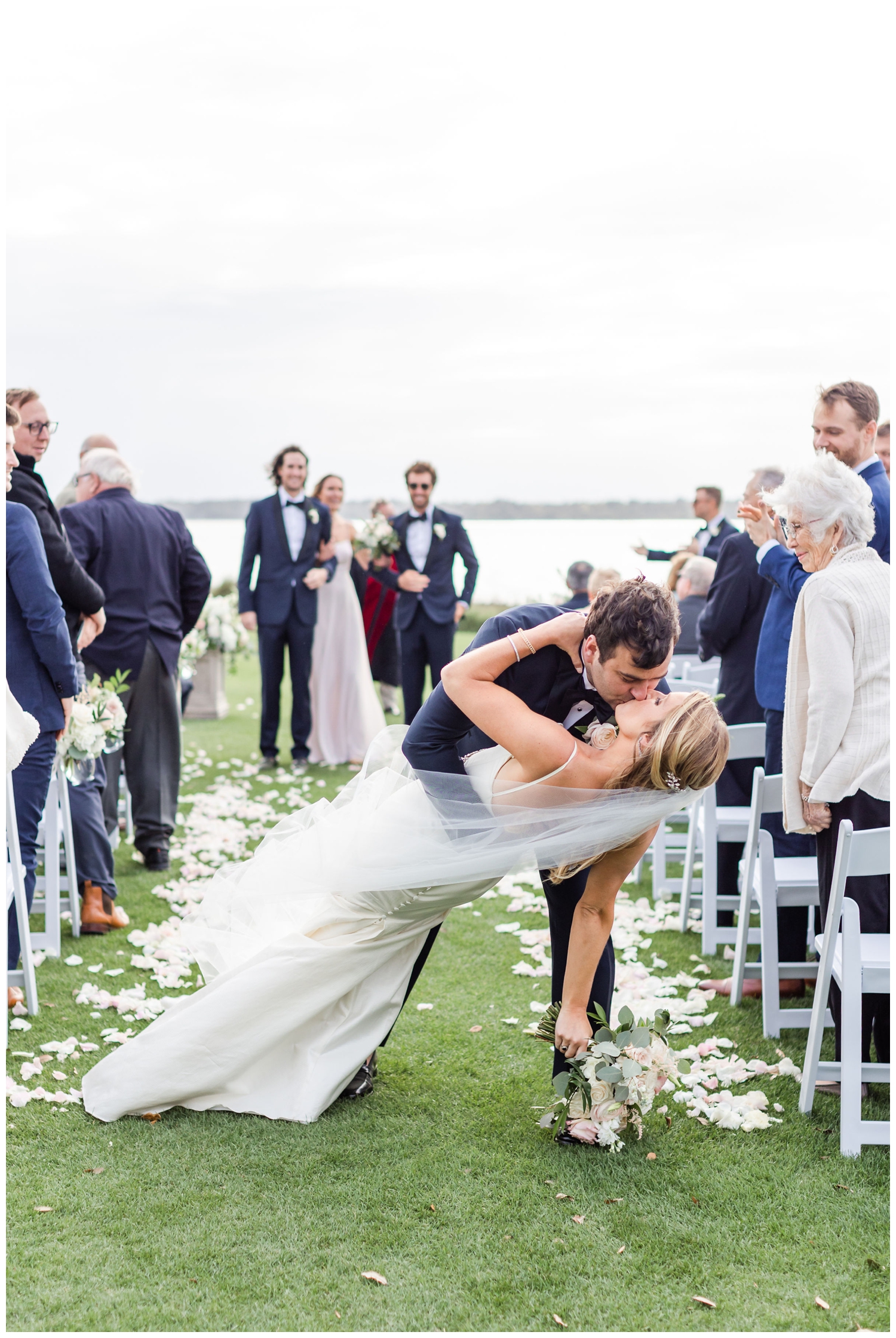 groom dipping his bride after ceremony at Sea Pines Resort wedding