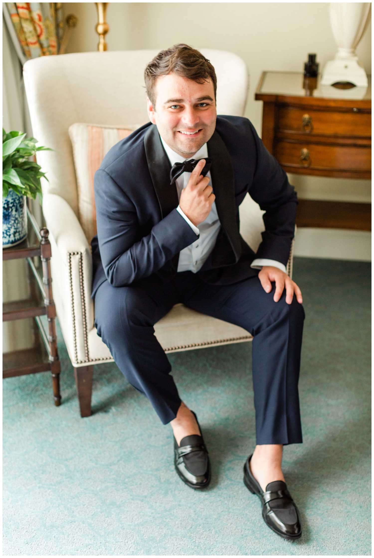 groom smiling while getting ready inside at Sea Pines Resort wedding