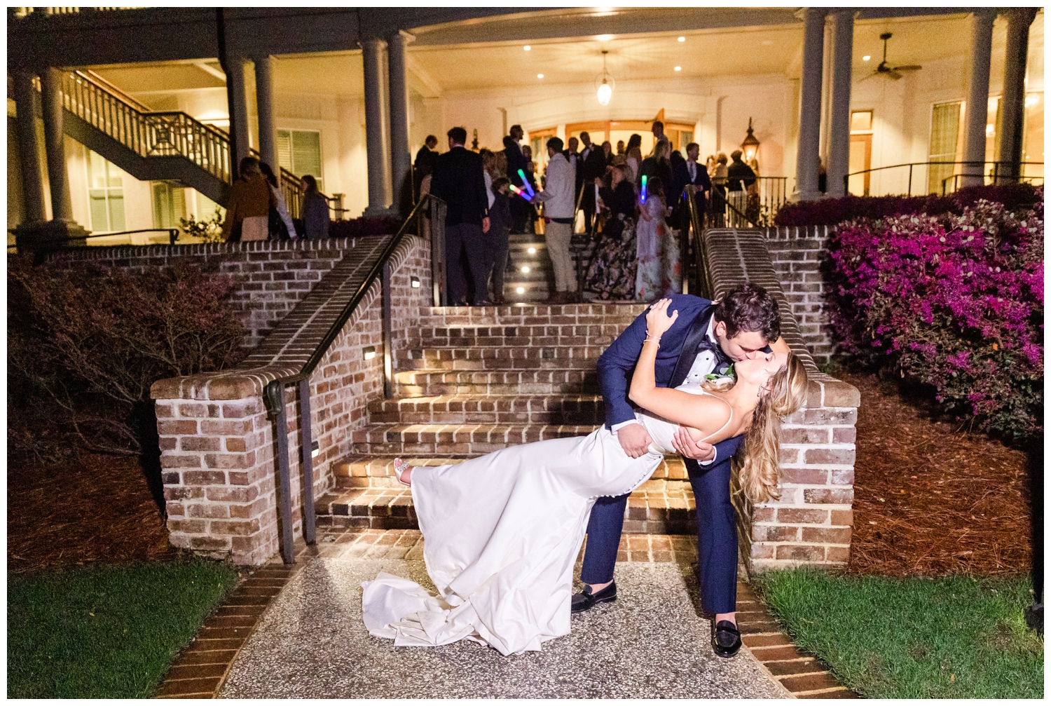 groom and bride kissing as they exit at Sea Pines Resort wedding venue
