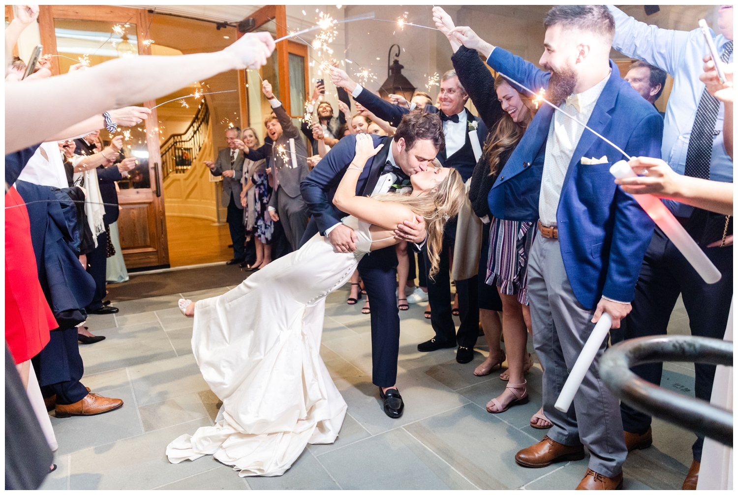 newlyweds kissing during sparkler exit at Sea Pines Resort wedding venue