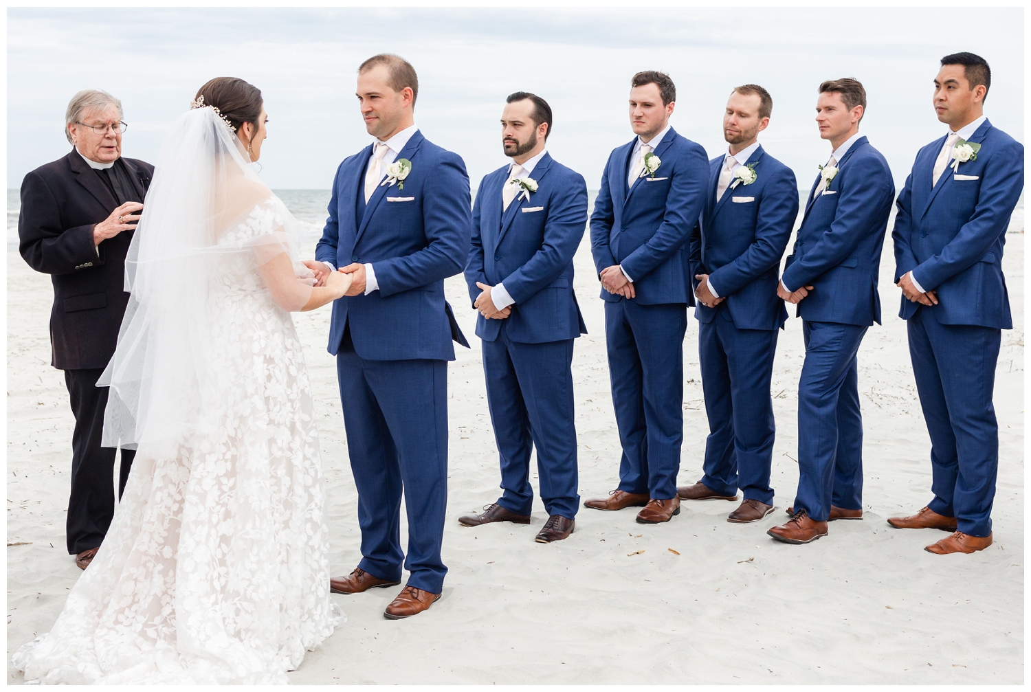 bride holding groom's hand at intimate Hilton Head wedding beach ceremony