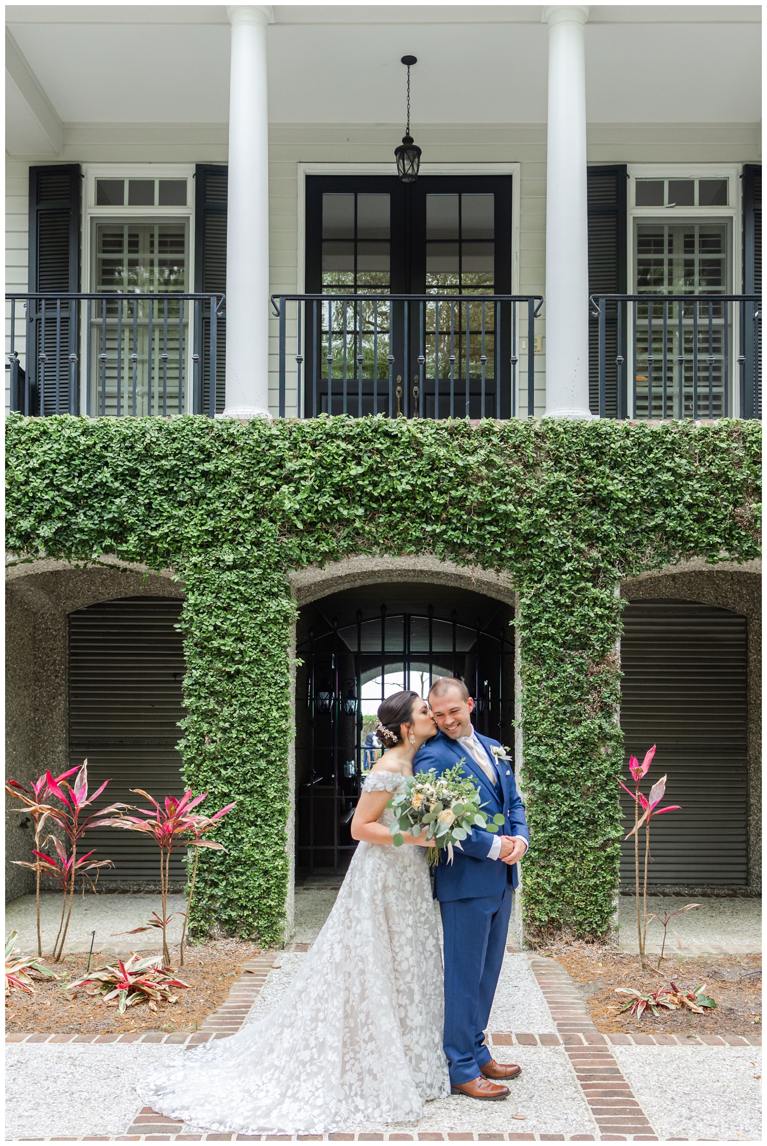 bride and groom posing in front of ivy wall at intimate Hilton Head wedding