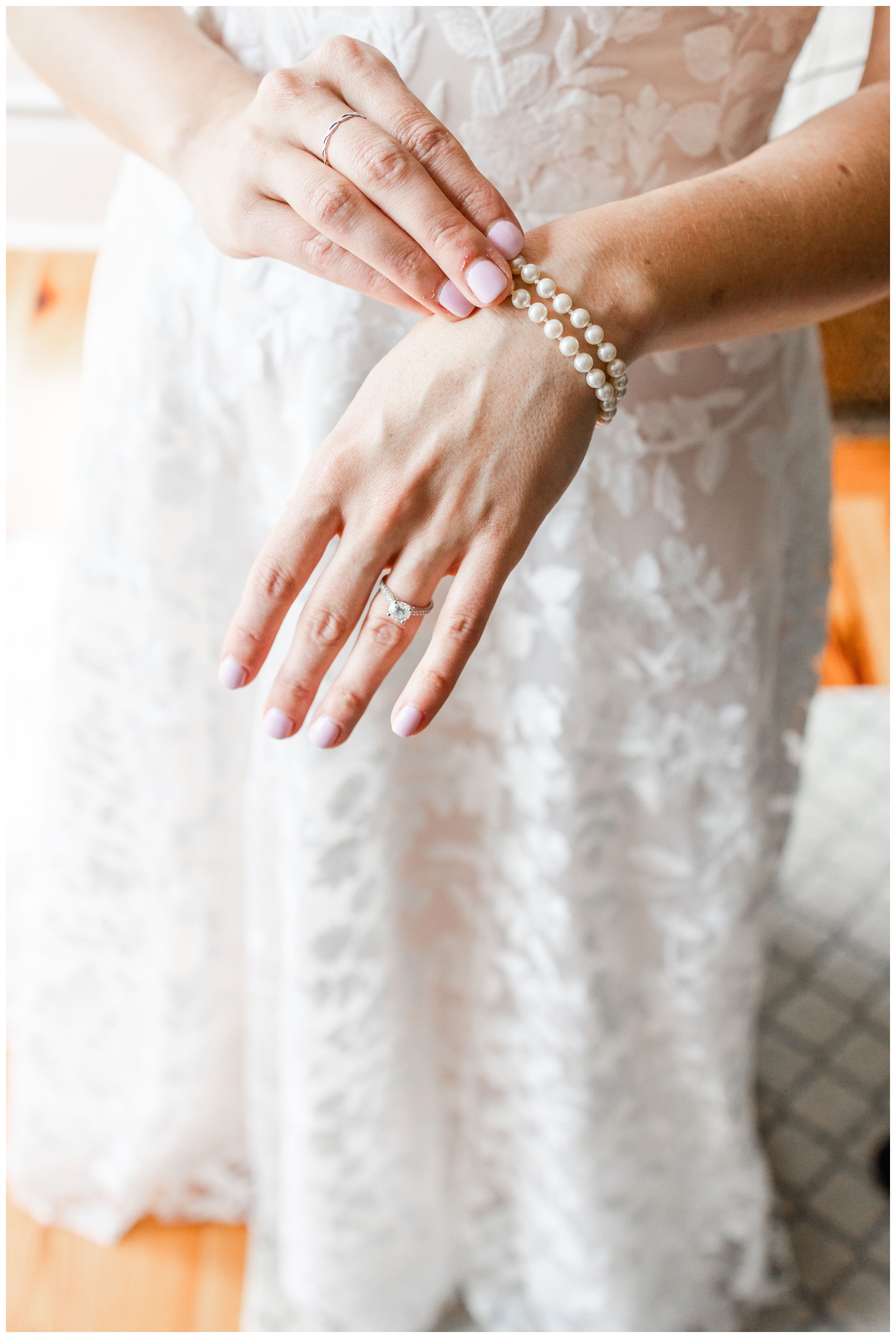 bride playing with pearls on her hand during Hilton Head wedding