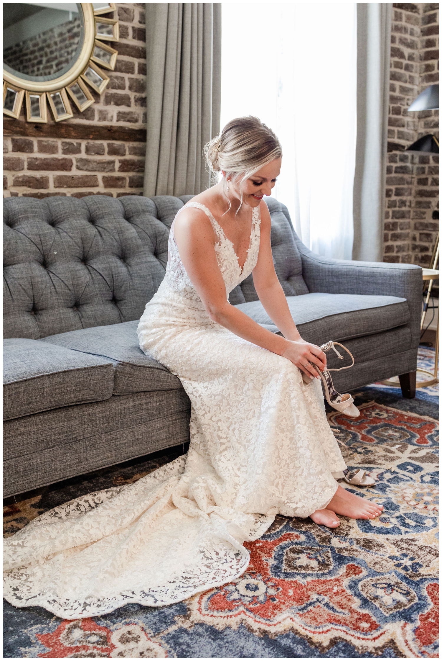bride putting on heels inside The Cedar Room Charleston wedding