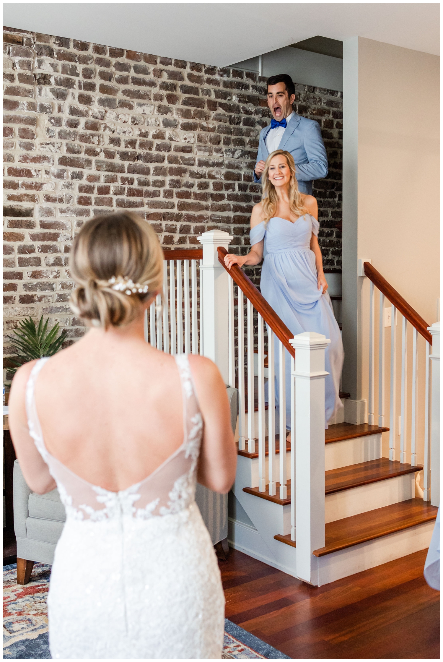 bride first look with bridesmaid inside The Cedar Room Charleston wedding