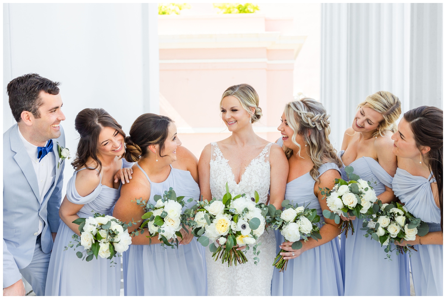 bride with bridesmaid in blue dresses