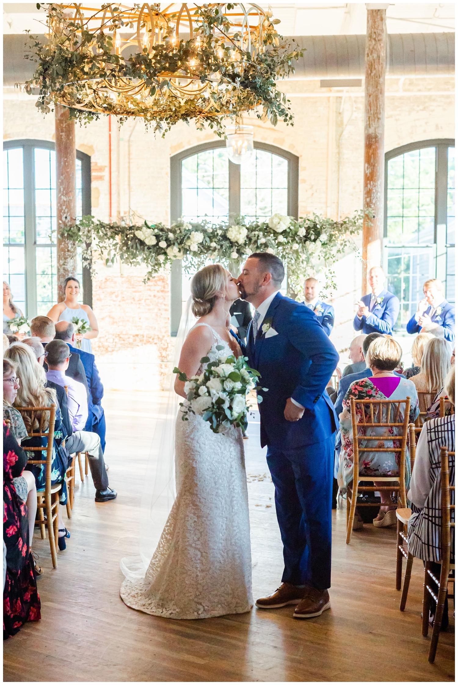 newlywed exit and kiss inside The Cedar Room Charleston Wedding