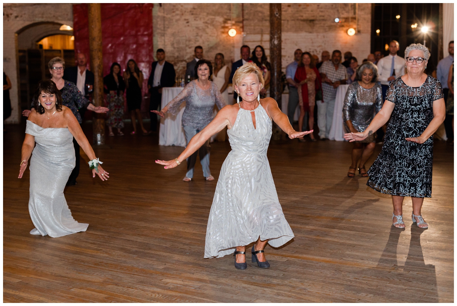 guest in white dress dancing at reception