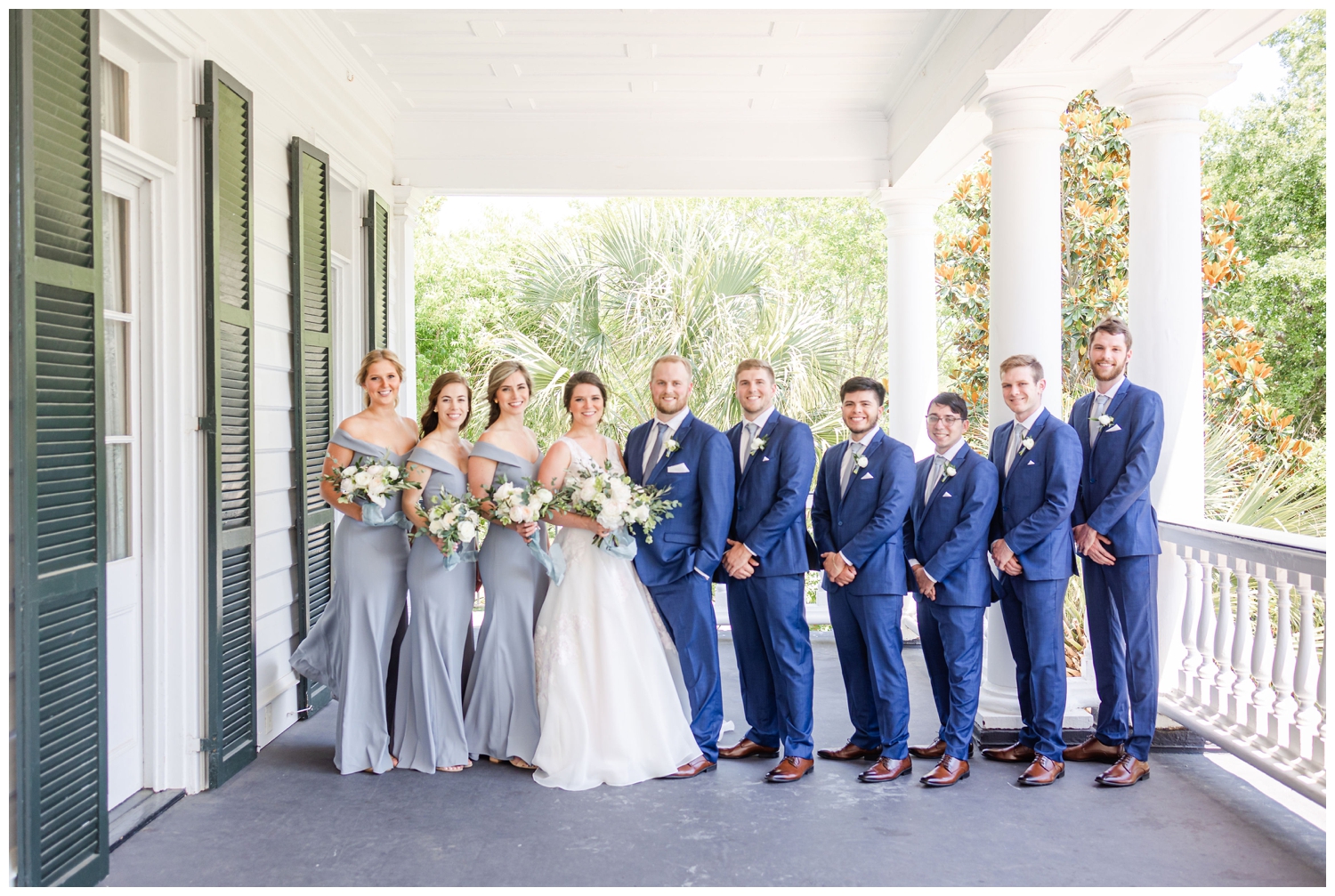 bridal party portrait standing under the front porch at Lowndes Grove