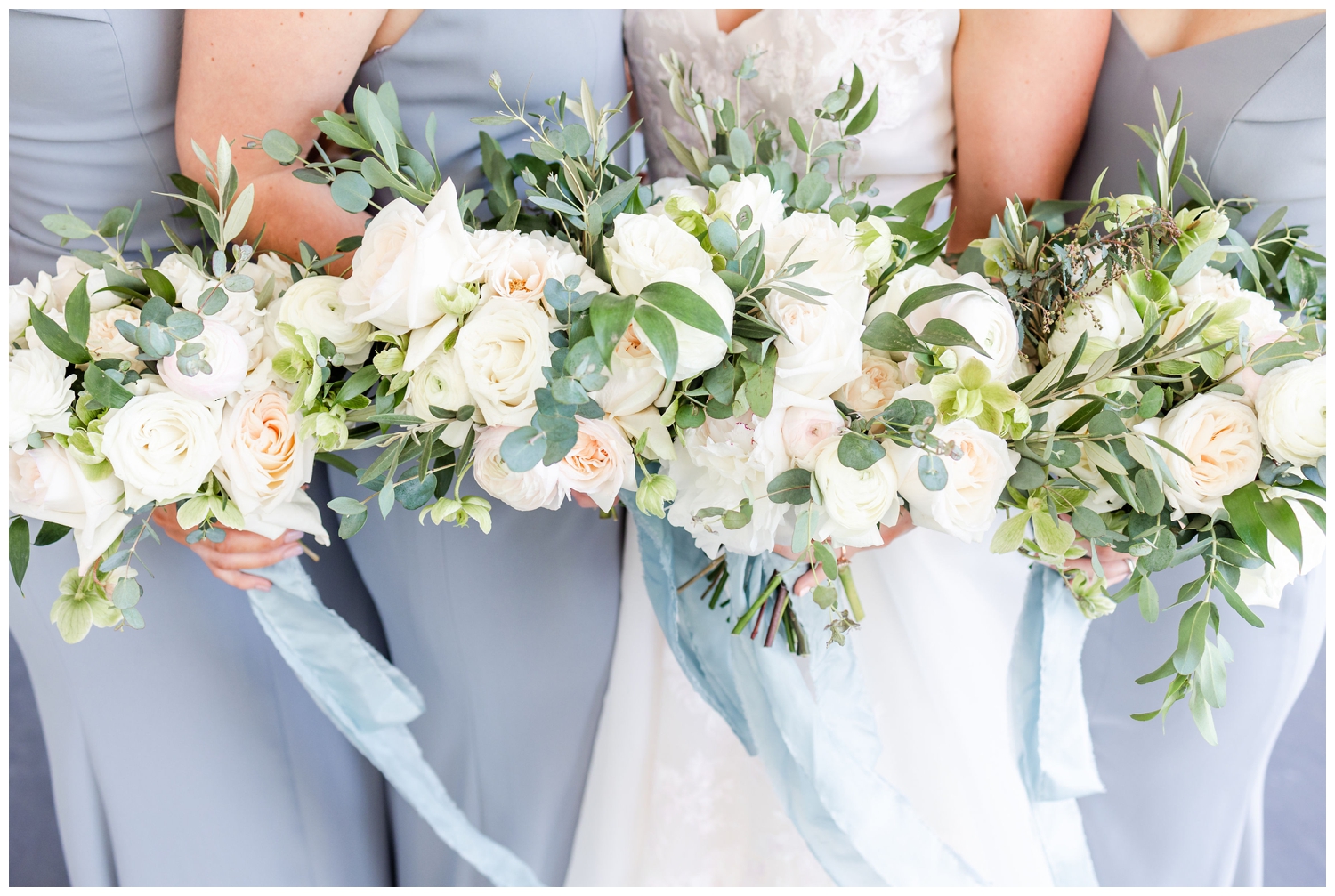 all white bridesmaids bouquets with pale blue ribbon