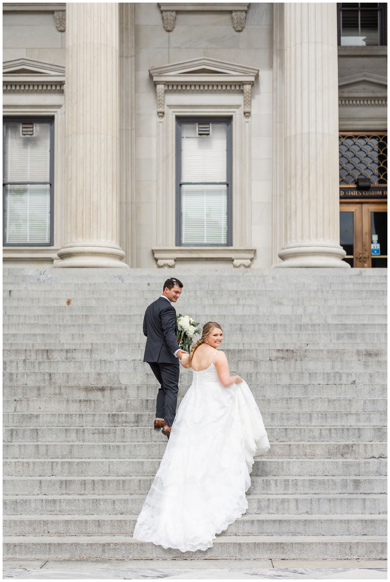 bride and groom walking up the steps at Charleston Merchants Hall