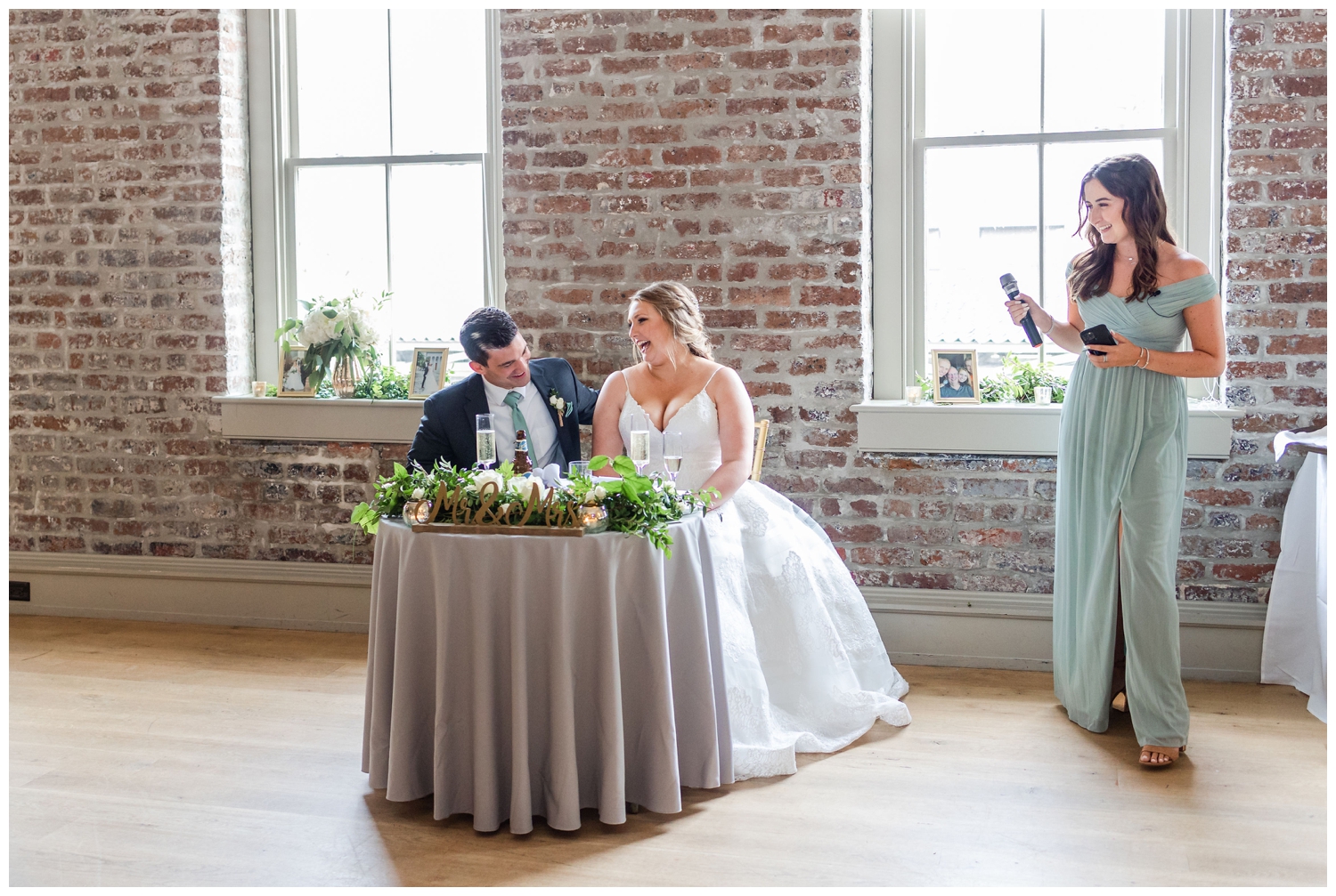 bridesmaid toasting newlyweds at Charleston Merchants Hall Reception