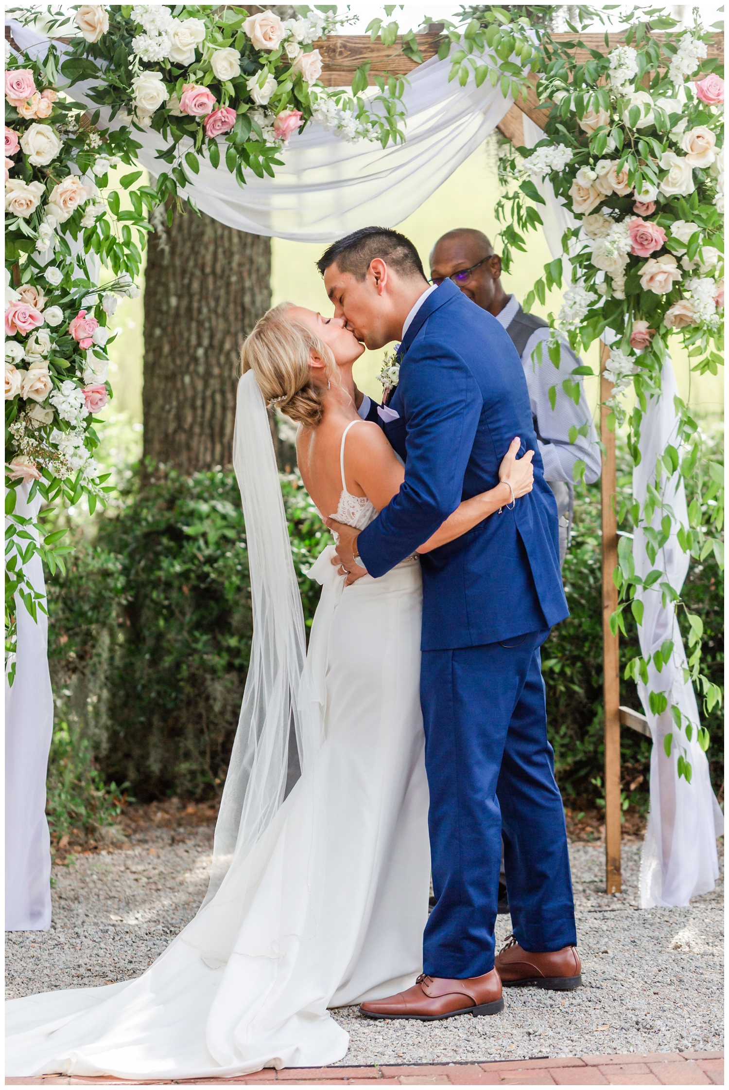 newlyweds ceremony kiss outdoors at Creek Club I'On