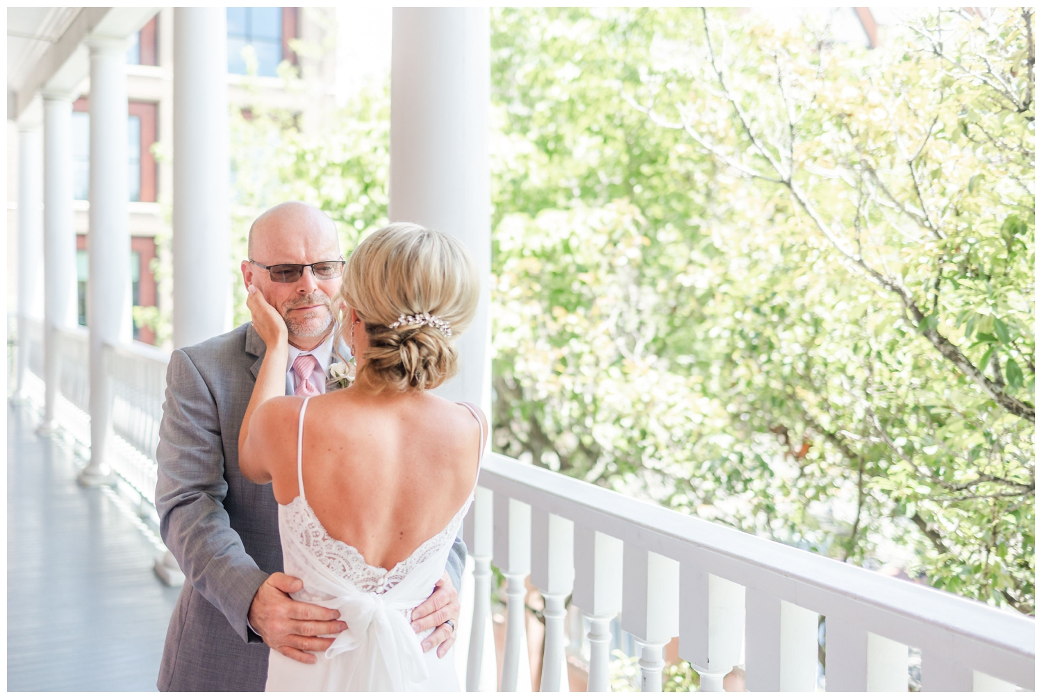 bride and father on veranda for southern summer wedding Charleston during first look