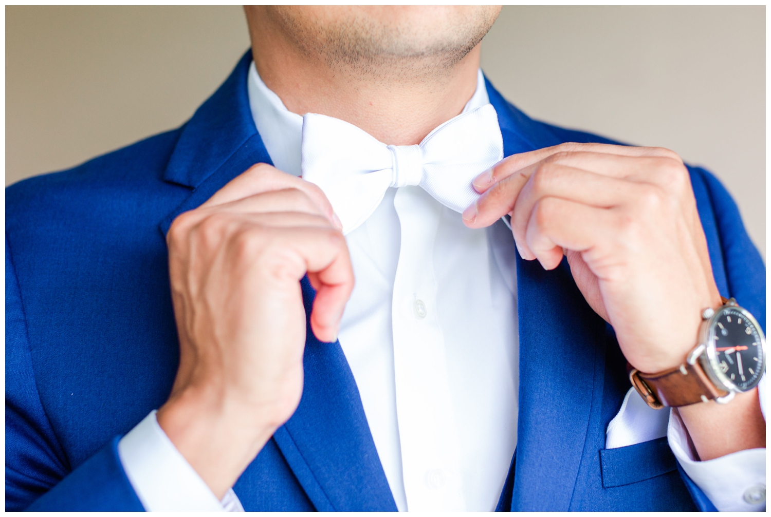 groom and white blue tie blue suit
