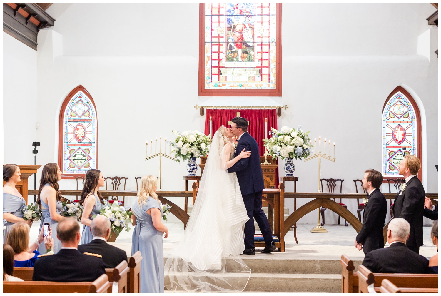 bride and groom kissing ceremony at St. Luke's Chapel Charleston