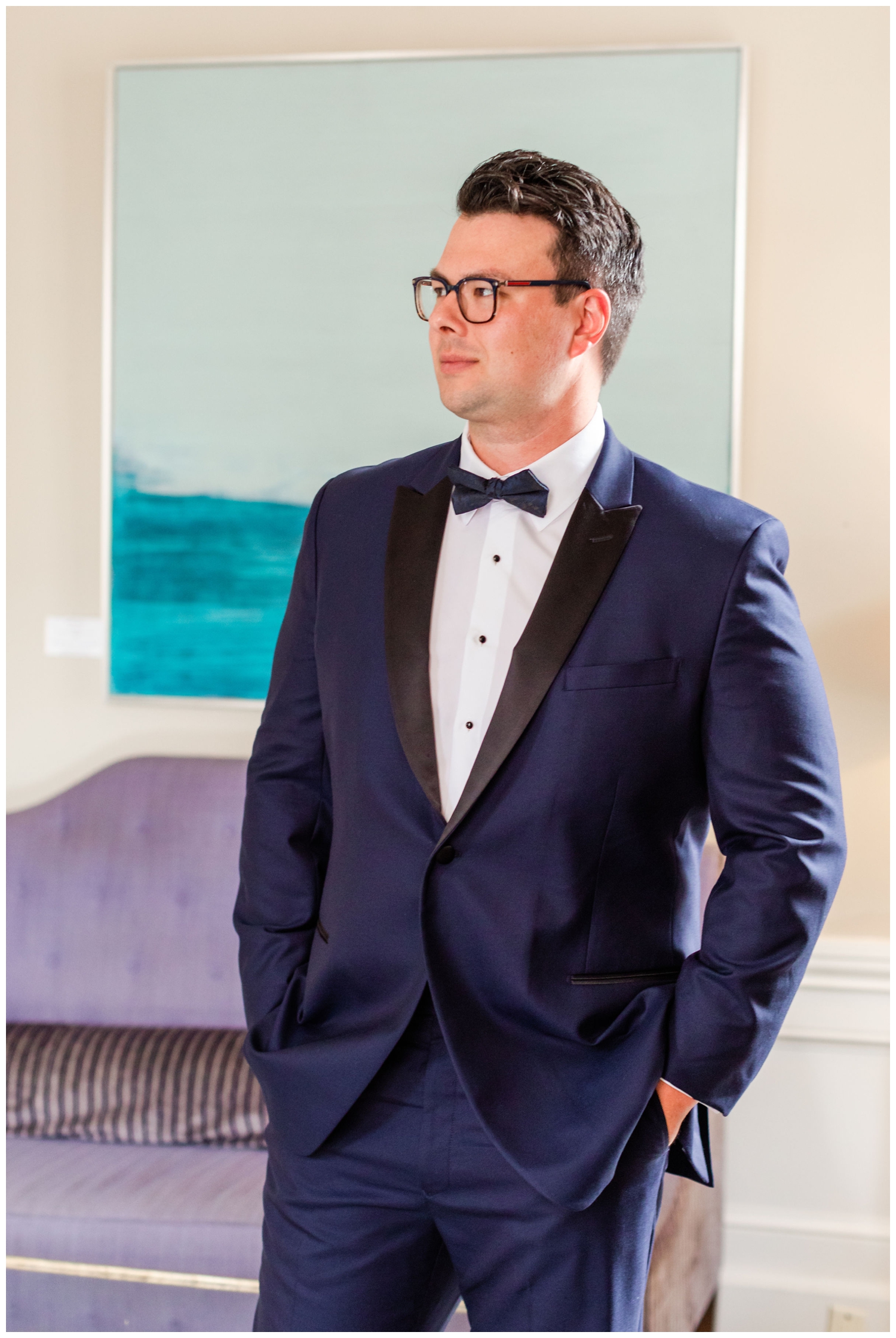 groom portrait in blue tux inside Hotel Bennett